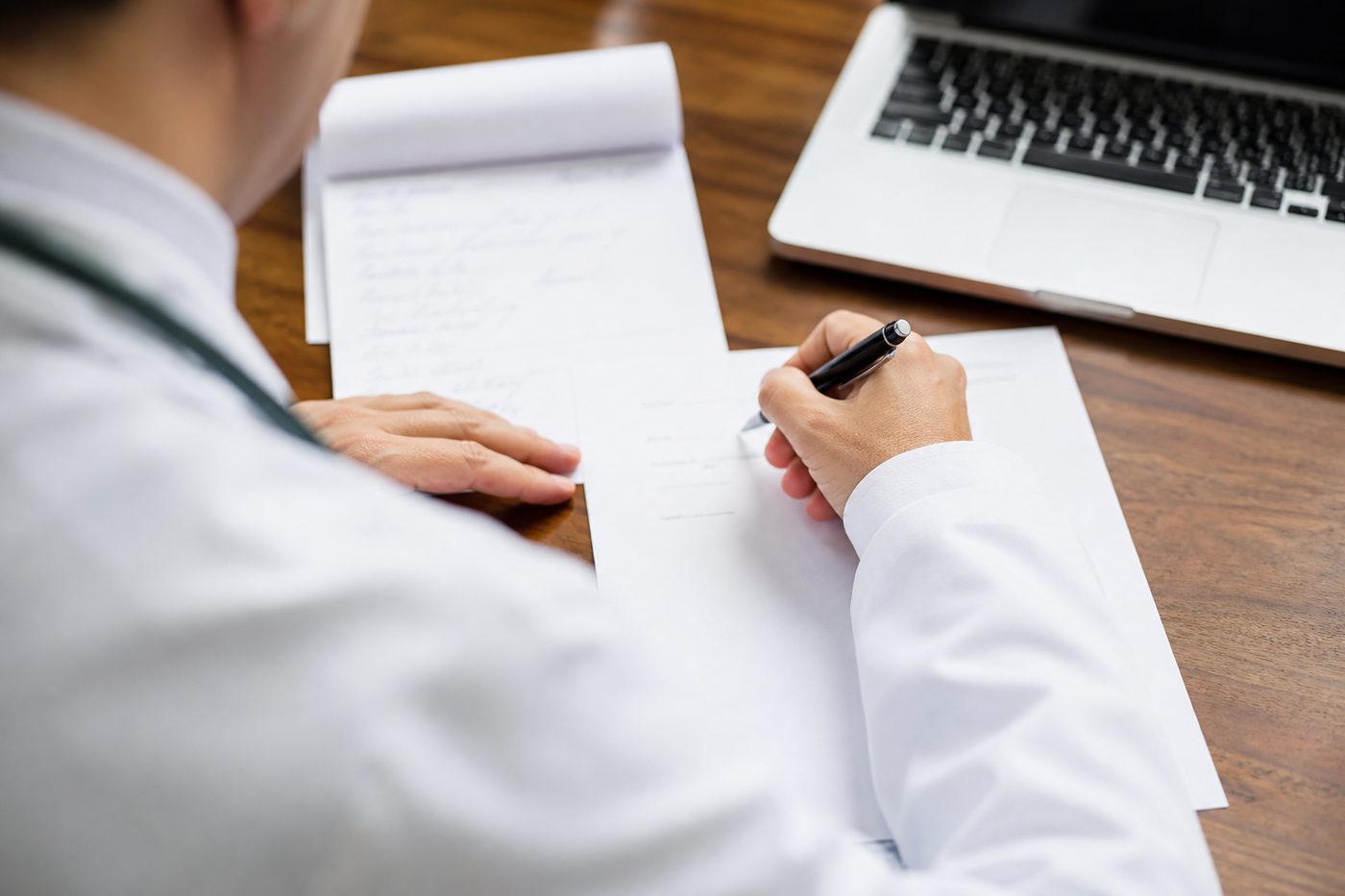GP preparing a medical letter and referral